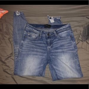 Buckle black skinny jeans